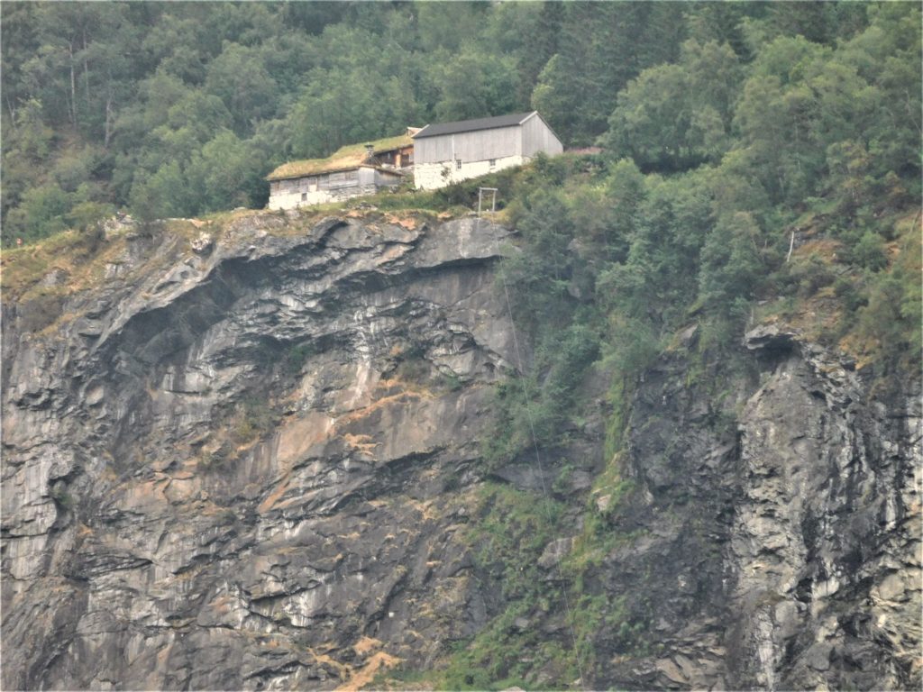 house on mountain on geirangerfjord