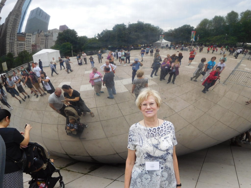 standing in front of The Bean