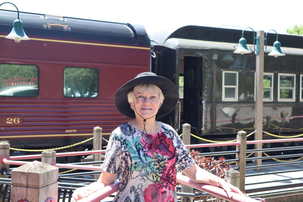 author in front of train
