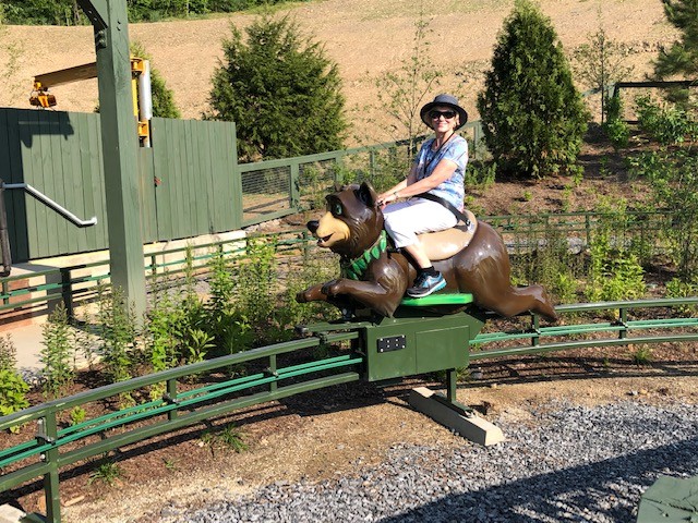 author on bear ride in Dollywood